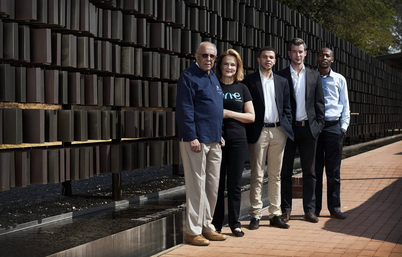 Ahmed Kathrada with One Young World Co-Founder Kate Robertson and One Young World Ambassadors at Lilisleaf Farm