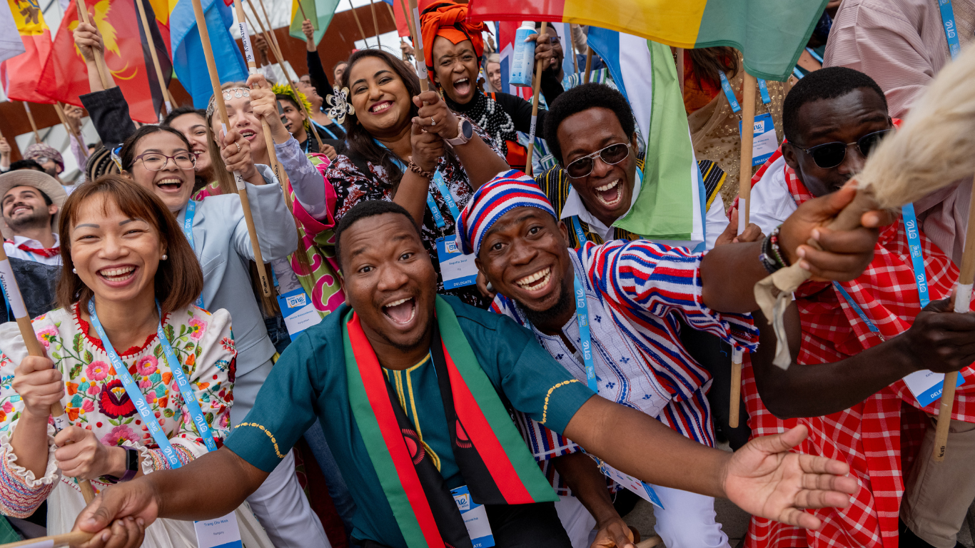 Image of flag bearers at the One Young World Summit Belfast 2023 