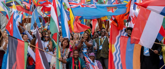 Image of flag bearers at the One Young World Summit Belfast 2023