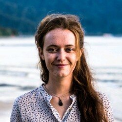 Anne-Sophie Roux portrait with beach in the background